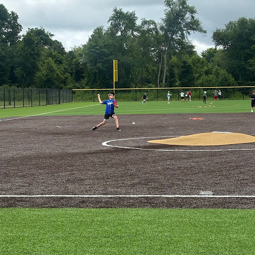 Players working on throwing at 1733 Baseball camp